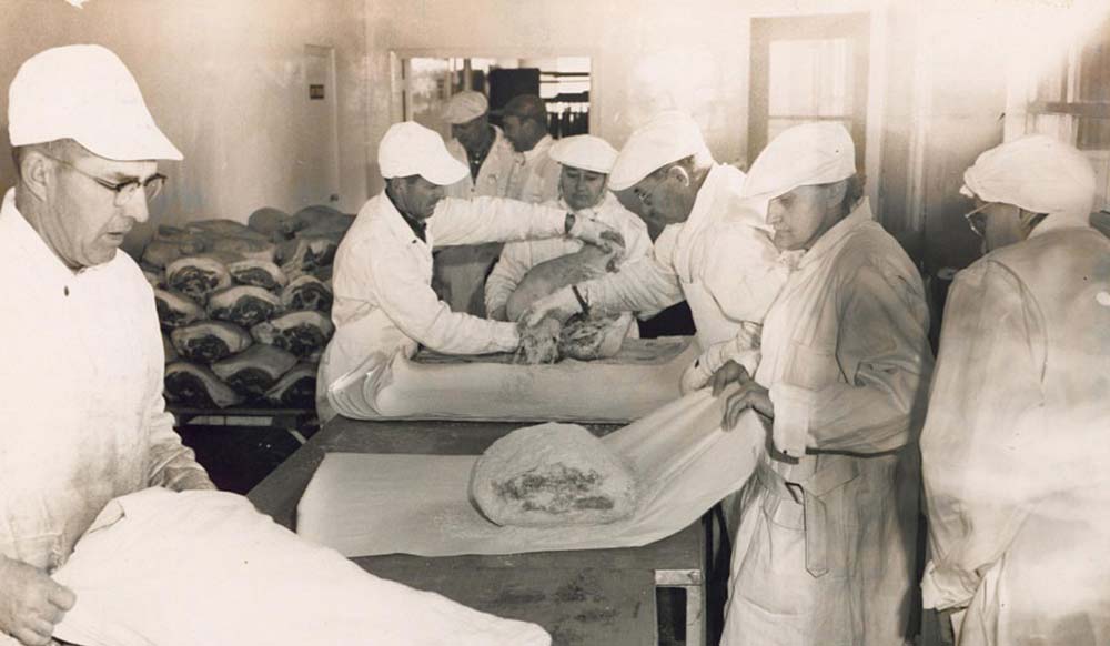 1956-Around-the-Curing-Table-Photo.2-up